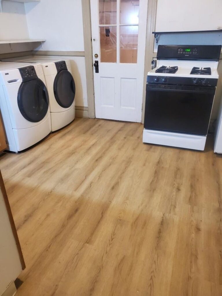 Luxury vinyl plank flooring installed in a kitchen in Denver, CO by Floors By Tomorrow